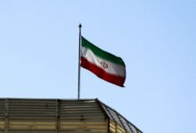 Iranian flag flying over a building