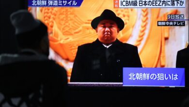 A screen monitor shows North Korean leader Kim Jong Un