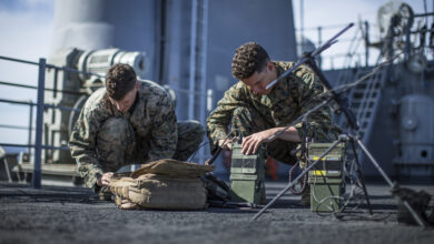 190315-M-EC058-0043 PACIFIC OCEAN (March 15, 2019) U.S. Marine Corps Lance Cpl. Gregory Weldon (left) and Cpl. Juan Perezramos, both field radio operators with Lima Company, Battalion Landing Team 3/5, 11th Marine Expeditionary Unit (MEU), assemble satellite communication antennas aboard the amphibious assault ship USS Boxer (LHD 4). The Marines and Sailors of the 11th MEU are conducting routine training as part of the USS Boxer Amphibious Ready Group in the eastern Pacific Ocean. (U.S. Marine Corps photo by Lance Cpl. Dalton S. Swanbeck)