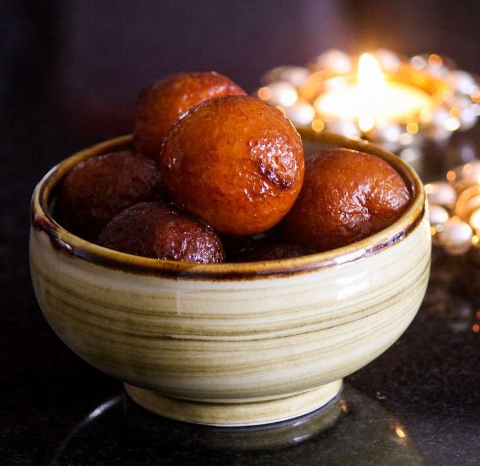 Fried milk powder based dough balls soaked in a saffron and cardamom sugar syrup