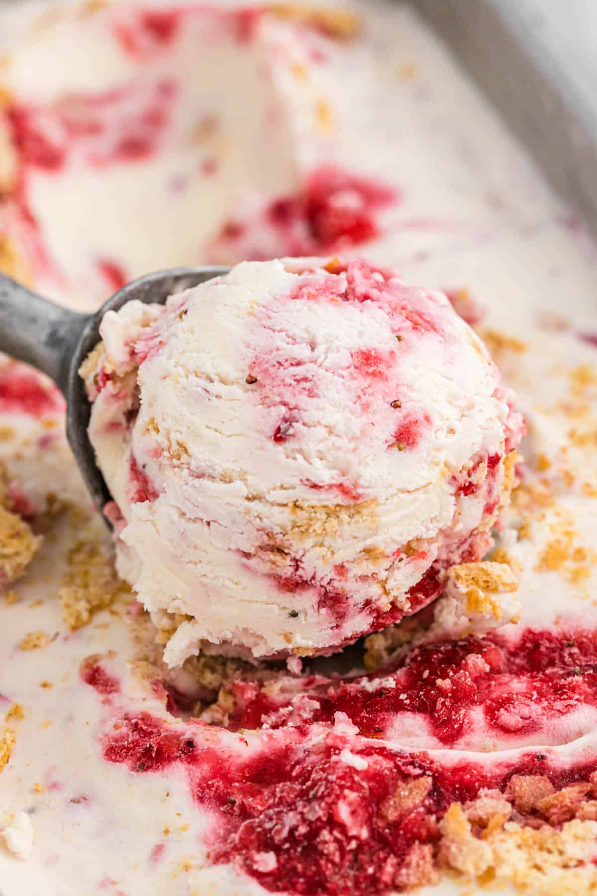 scoop of strawberry cheesecake ice cream in ice cream scoop