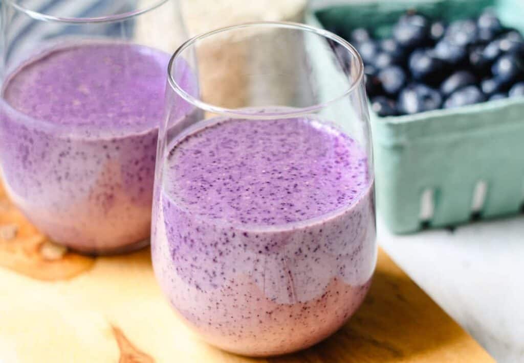 Blueberry oatmeal smoothie in a glass.