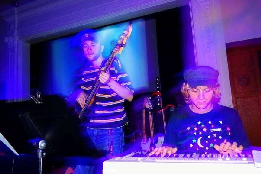 From left, bassist Brendan Meriney and keyboardist junior Christopher Tassone performed with band Little Slicer at the Community School of Music and Arts. 