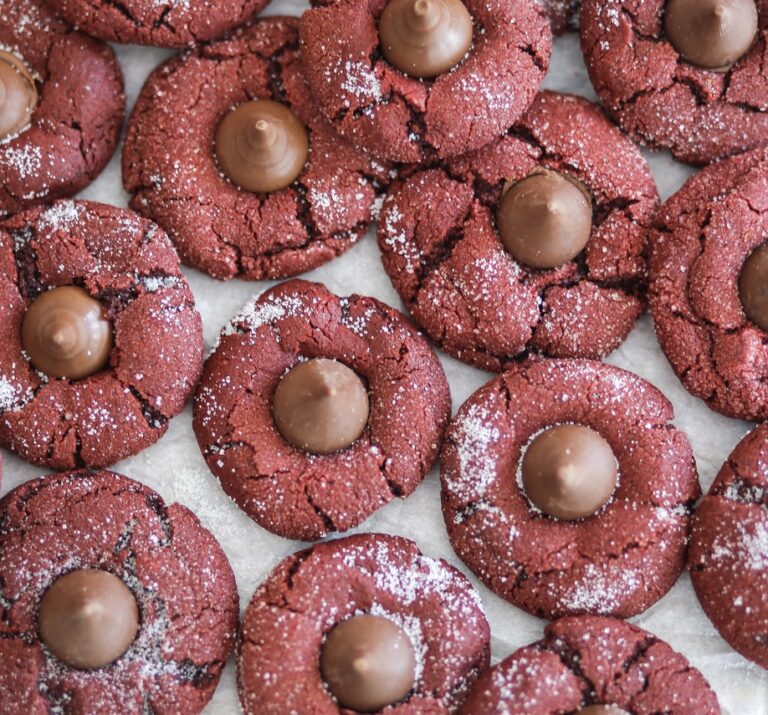 A close up of cookies with chocolate balls on top