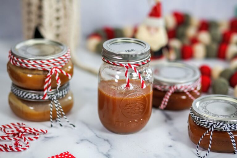 A table topped with jars of food on top of a white counter.