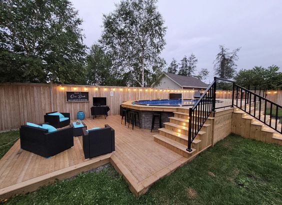 Above-ground Pool With Stone Paneling, Low Deck For Seating Area And Stairs