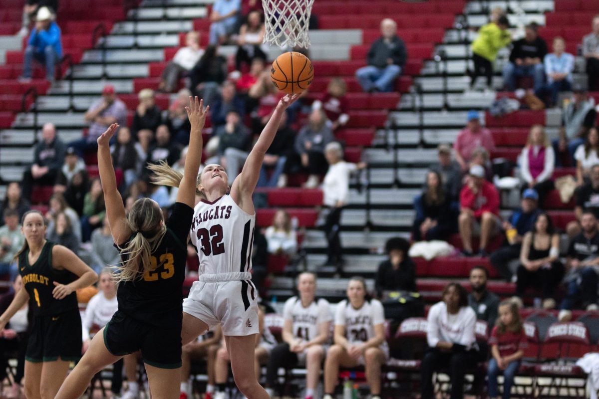 Chico State’s Makenzi Laporte going up for a contested left-handed layup in the first half of Saturday’s 77-54 win over the Cal Poly Humboldt Lumberjacks. Photo taken by Aaron Draper.