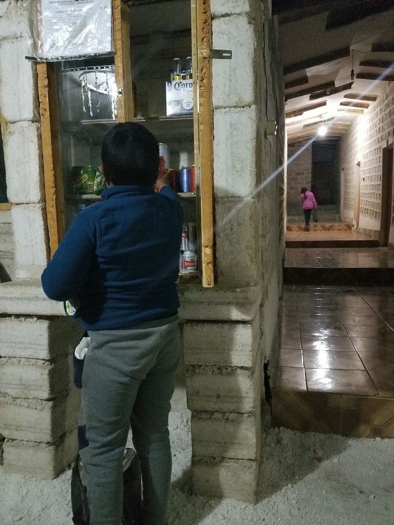 a boy standing in front of a window