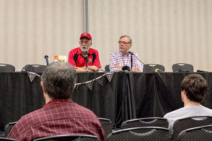 John Gunnison, left, and John Wooley examine the detectives of the Thrilling magazines.