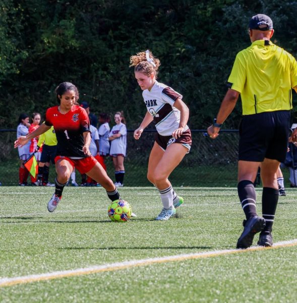 Defensive midfielder Devyn Barnes faces off against a park player on Rivalry Day, September 28.