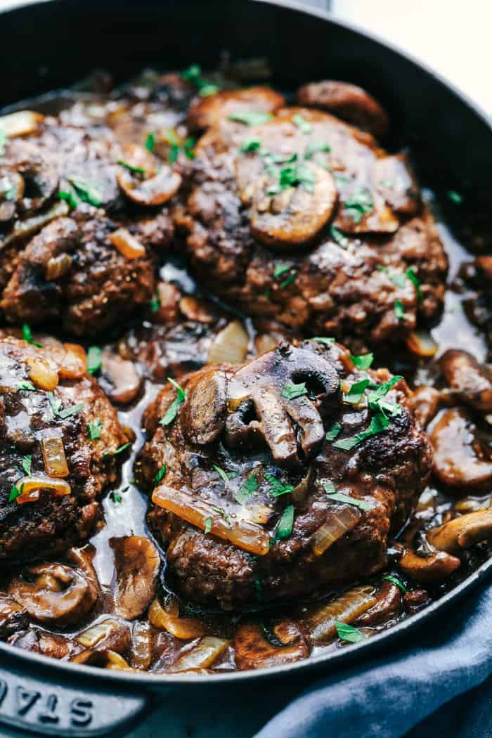 Skillet Salisbury Steaks in a black cast iron pan.