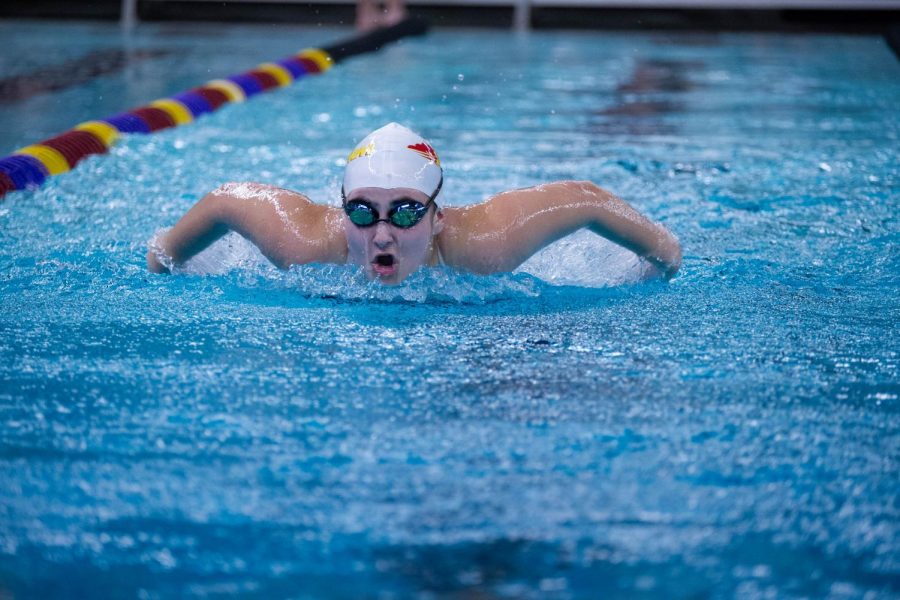 Riley Reece competes in the 100y butterfly. 