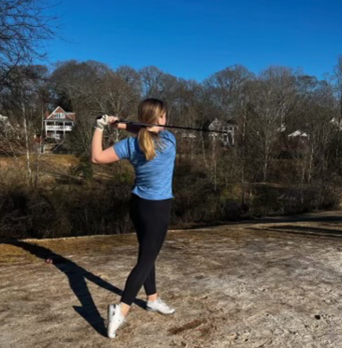 Lindsay Ruhl practices her swing at the Candler Park Golf Course.