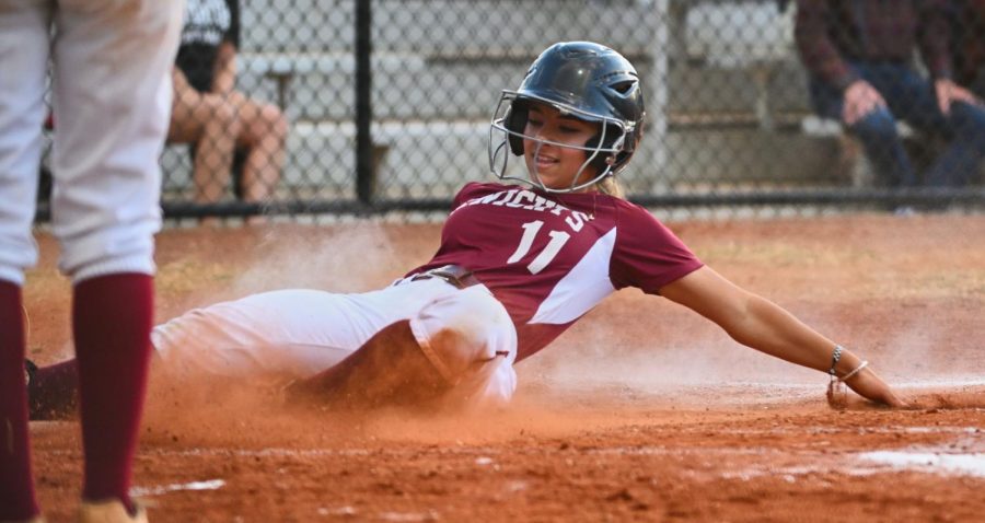 Senior Gabby Guerra slides into home plate on senior night against Mays.