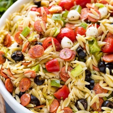 Classic Italian orzo pasta salad, complete with a homemade dressing and mini pepperonis. This traditional American pasta salad is great with an orzo pasta twist.