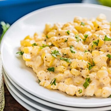 Creamed corn on a white plate.