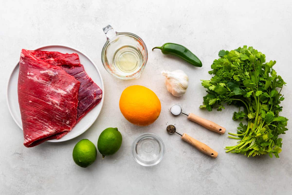 An overhead view of the ingredients needed to make our recipe for carne asada. 