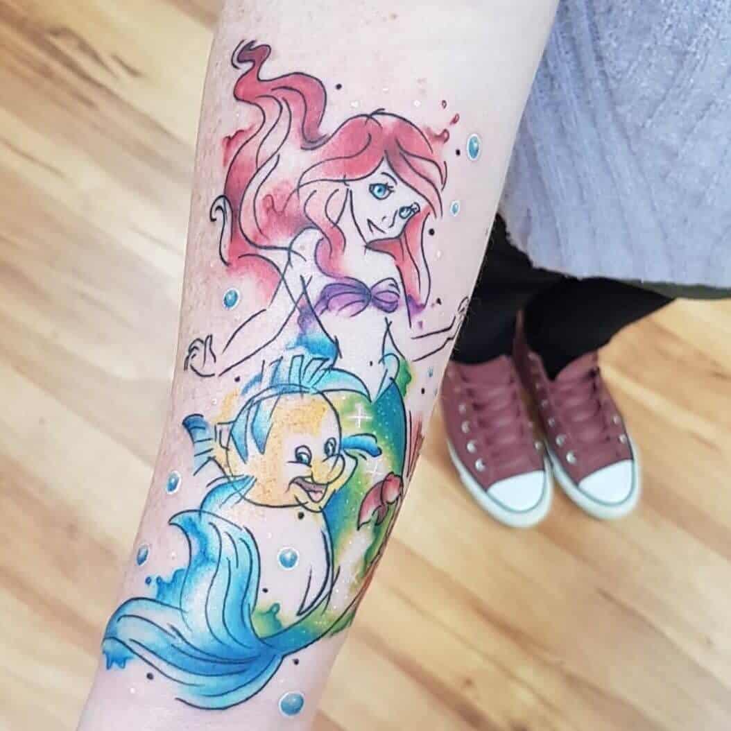 watercolor mermaid tattoo on arm