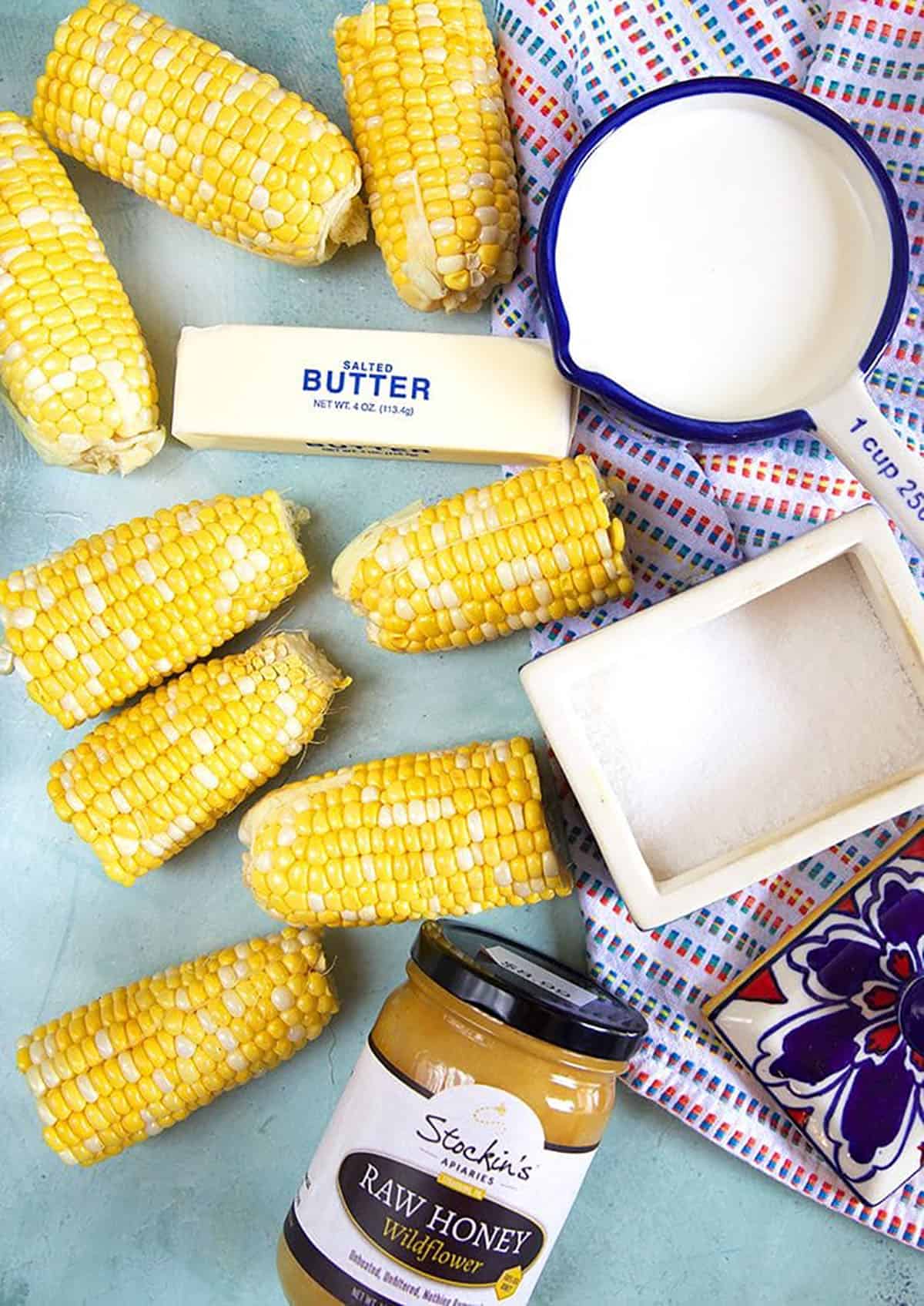 corn on the cob with butter, honey, salt and milk.