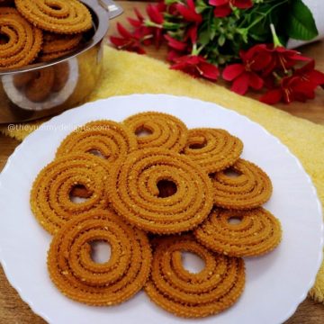 close-up of serving maharashtrian chakli on a white plate.