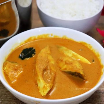 close-up of mangalorean fish curry in a white serving bowl.