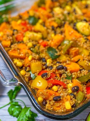 A casserole dish with black beans, corn, quinoa, sweet potato, and bell peppers.