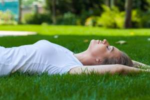 Woman laying in grass