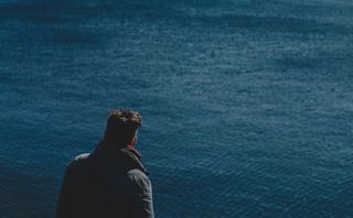 Man looking at water