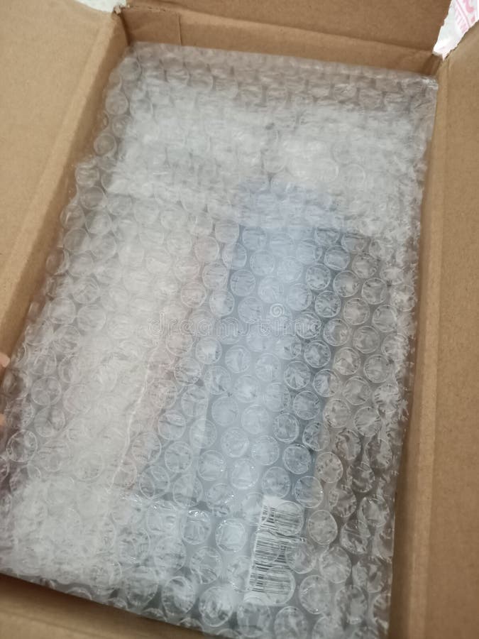 Bubble Wrap Packaging. Brown Box Stock Photo - Image of wrap, design ...