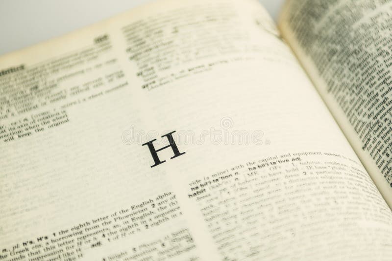 Closeup letter H in English dictionary stock images