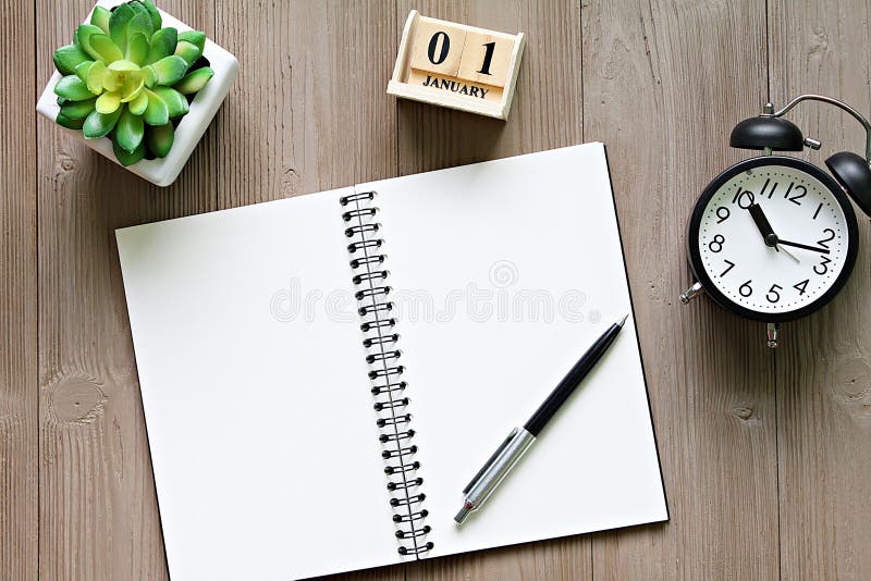 Open Notebook with Blank Pages, Coffee Cup and Clock on Wooden Desk ...