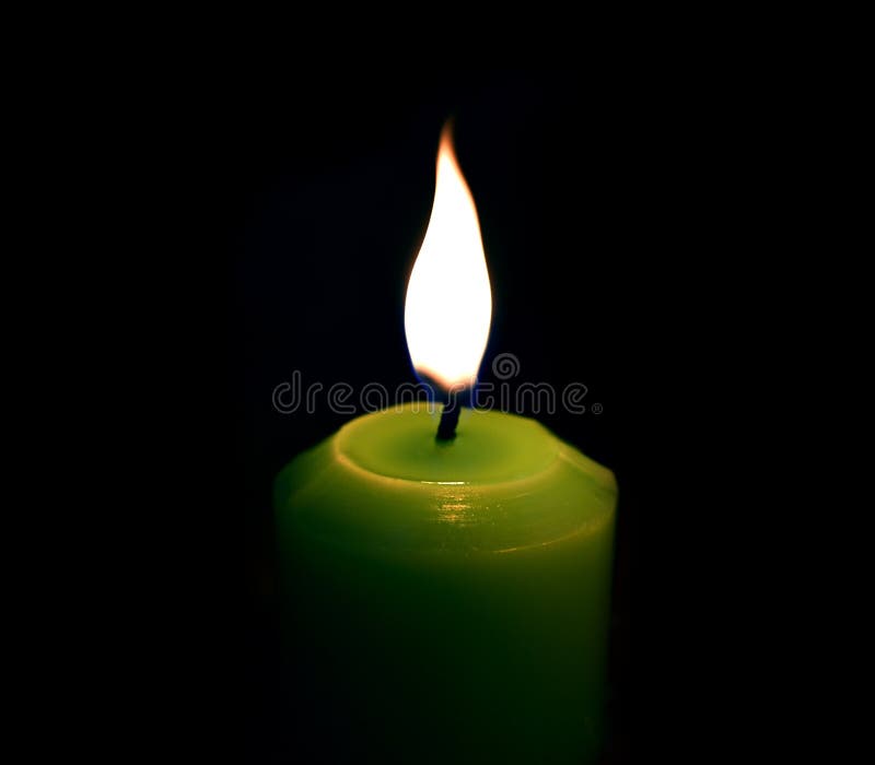 Green Candle Over a Black Background. Stock Image - Image of glowing, black:  174636305