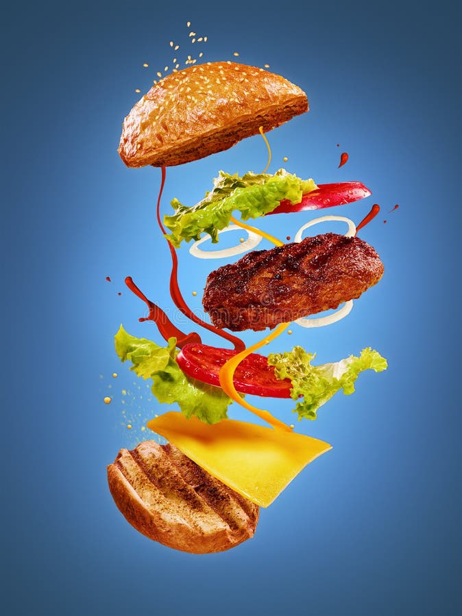 The Hamburger with Flying Ingredients on Blue Background Stock Image ...