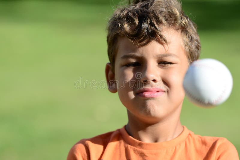 Boy Playing Baseball a sunny day with friends