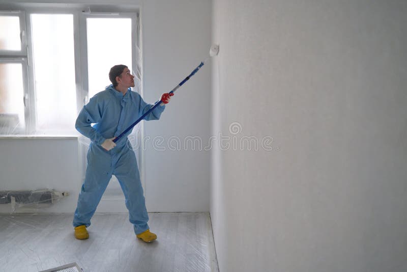 Man Paints the Ceiling with a Roller Stock Image - Image of improvement ...