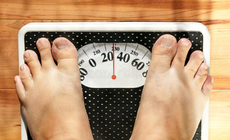 Obese feet on scale stock image. Image of measure, floor - 16993213