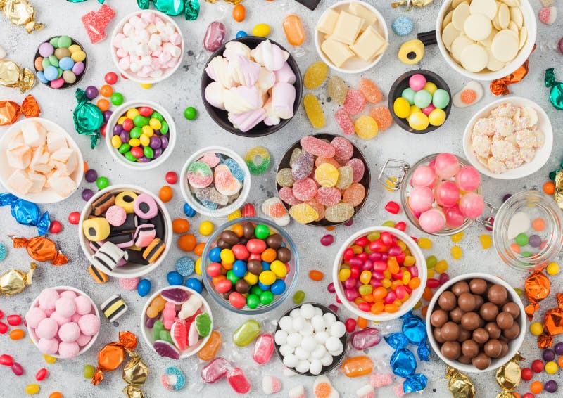 Pink Lollipop Candies in Jar with Various Milk Chocolate and Jelly Gums ...