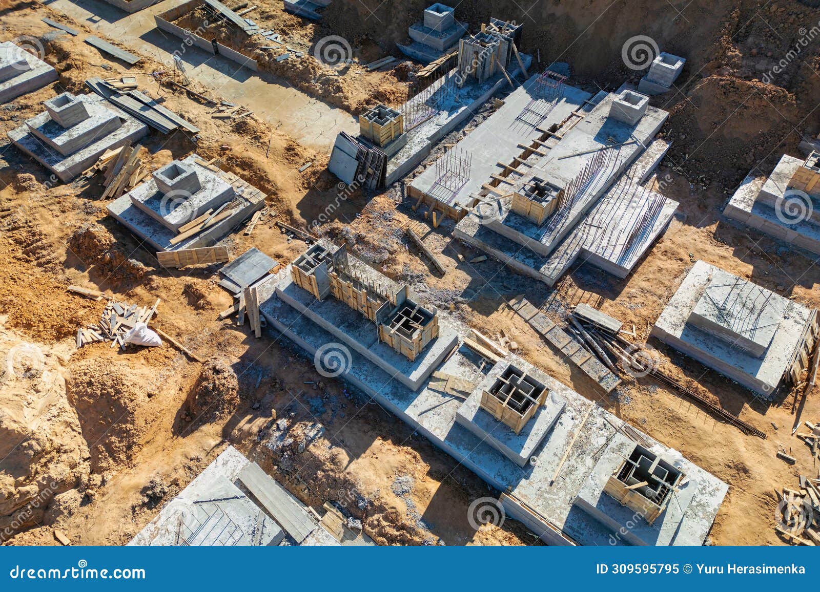 A Birds Eye View of a Building in Progress, with Workers, Cranes, and ...