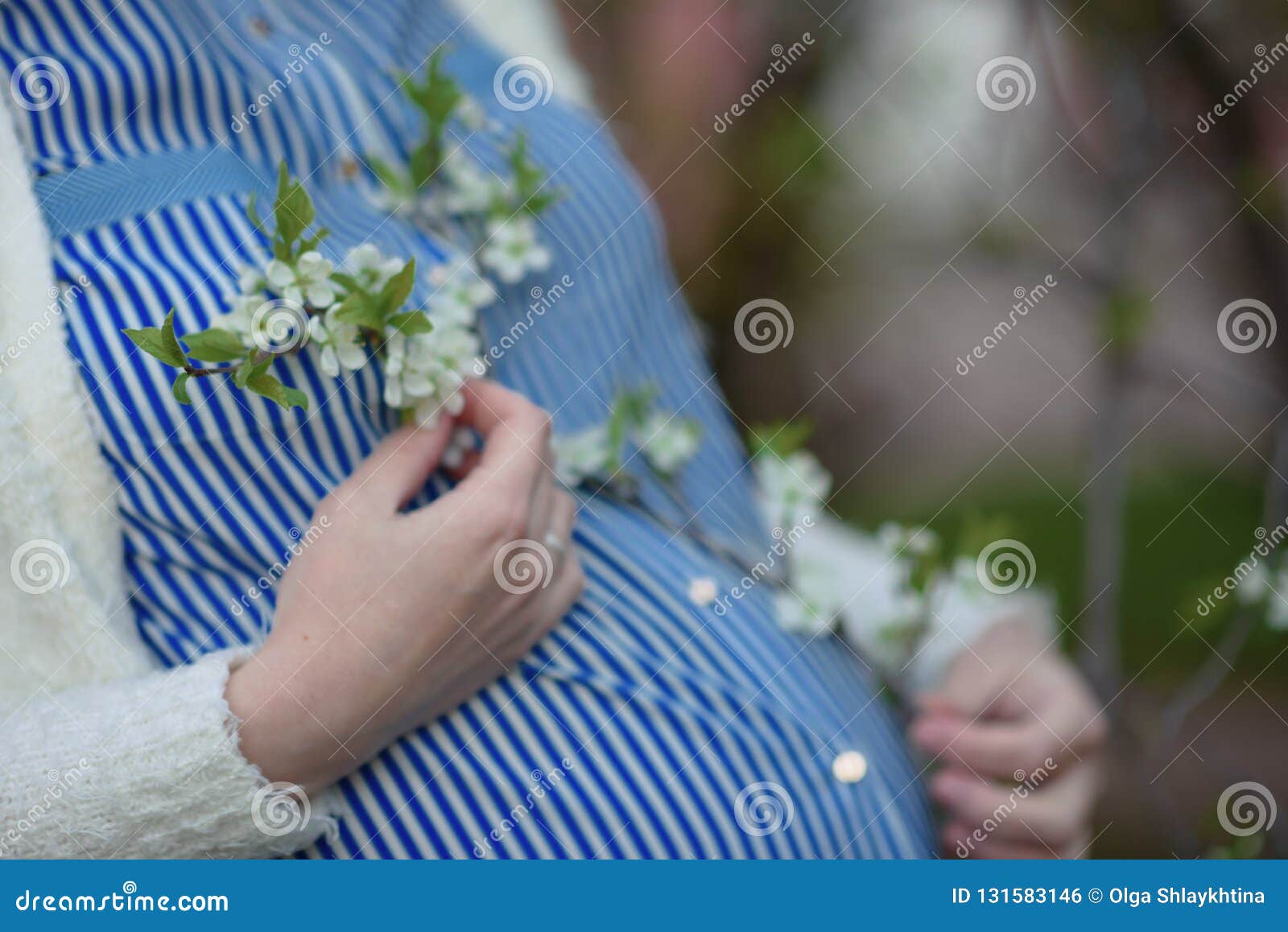 Pregnant Woman Holding Her Belly and Flower Stock Photo - Image of hand ...