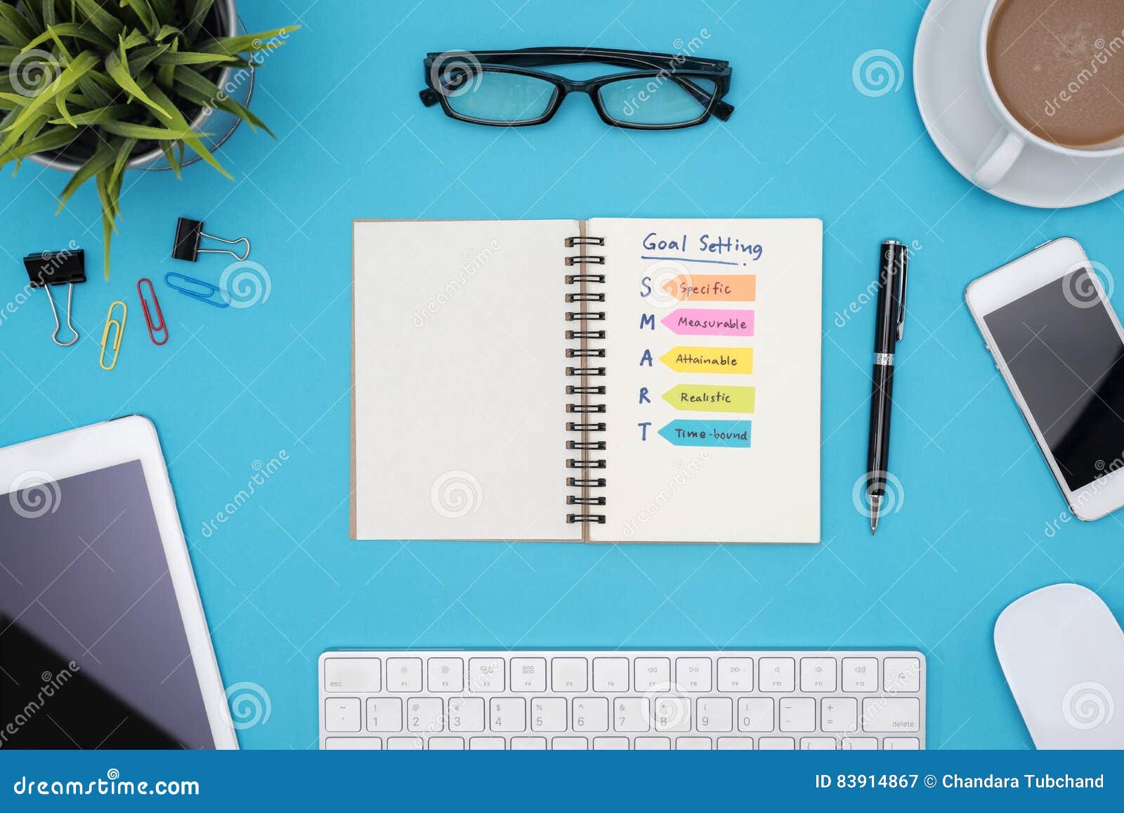 Smart Goal Setting with Office Supplies Over Blue Desk Stock Image ...