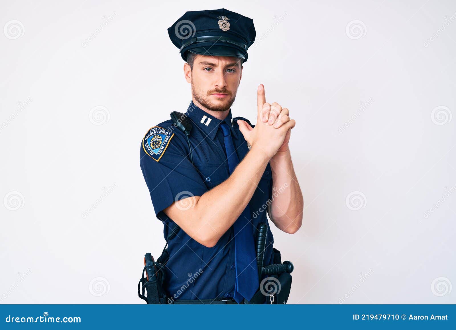 Young Caucasian Man Wearing Police Uniform Holding Symbolic Gun with ...