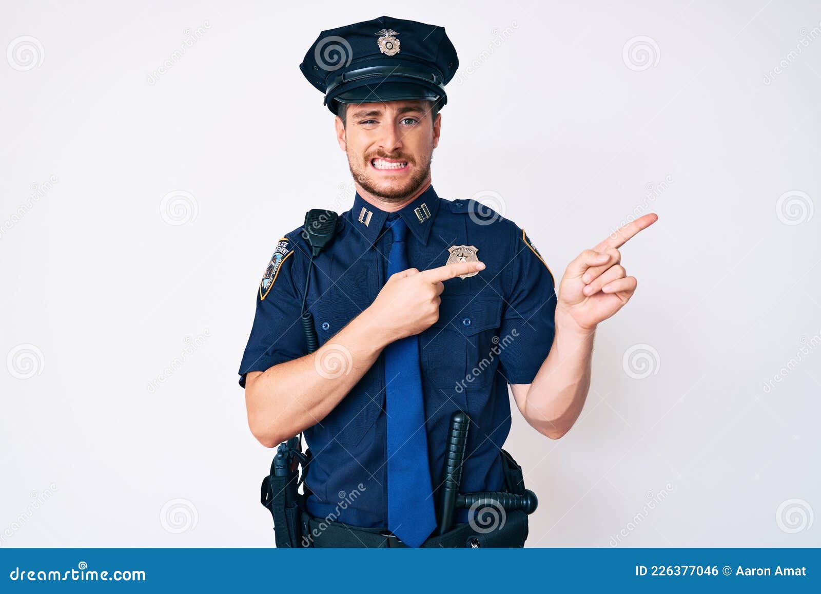 Young Caucasian Man Wearing Police Uniform Pointing Aside Worried and ...