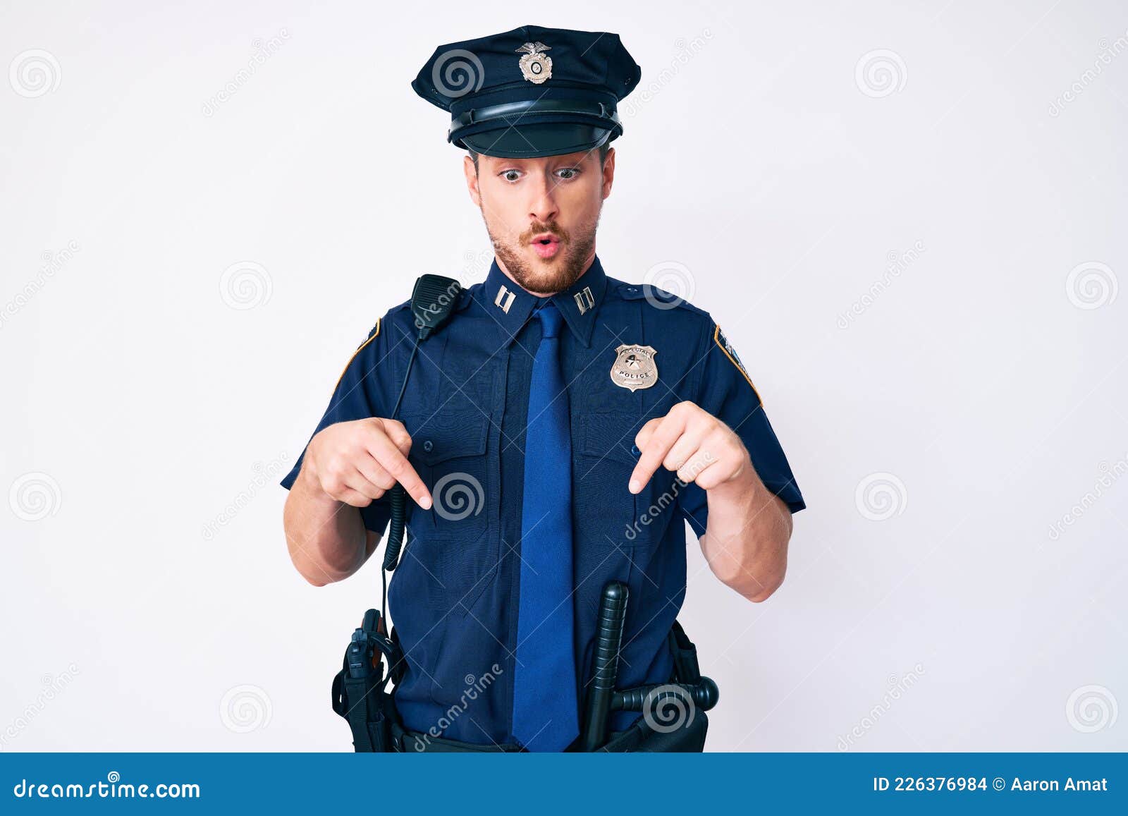 Young Caucasian Man Wearing Police Uniform Pointing Down with Fingers ...