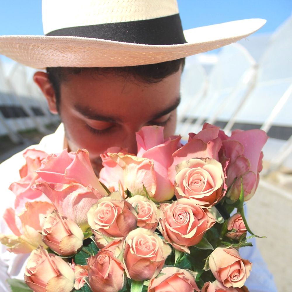 Man smelling EQR Roses 