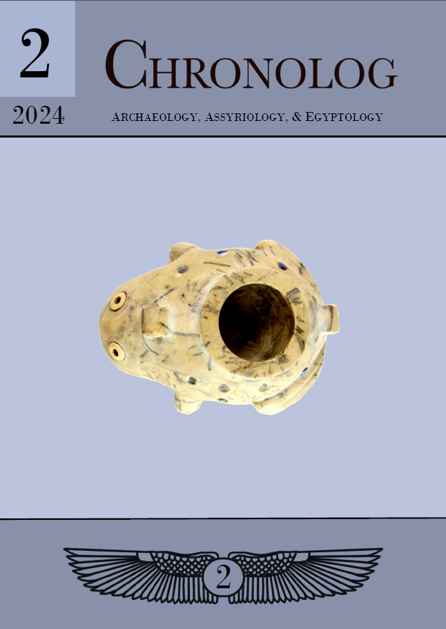 Front cover of issue 2, at the top of the image is the titel 2, 2024, Chronolog - archaeology, assyrology and egyptology, in black on a ligth bluish purple background. At the center is a white frog vessel with small holes, some still filled with lapis lazuli. Below is two outstreched vulture wings centered around a circle with a 2 in the middle. enter.