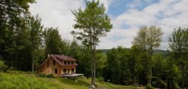 finished vermont timber frame home exterior with garden