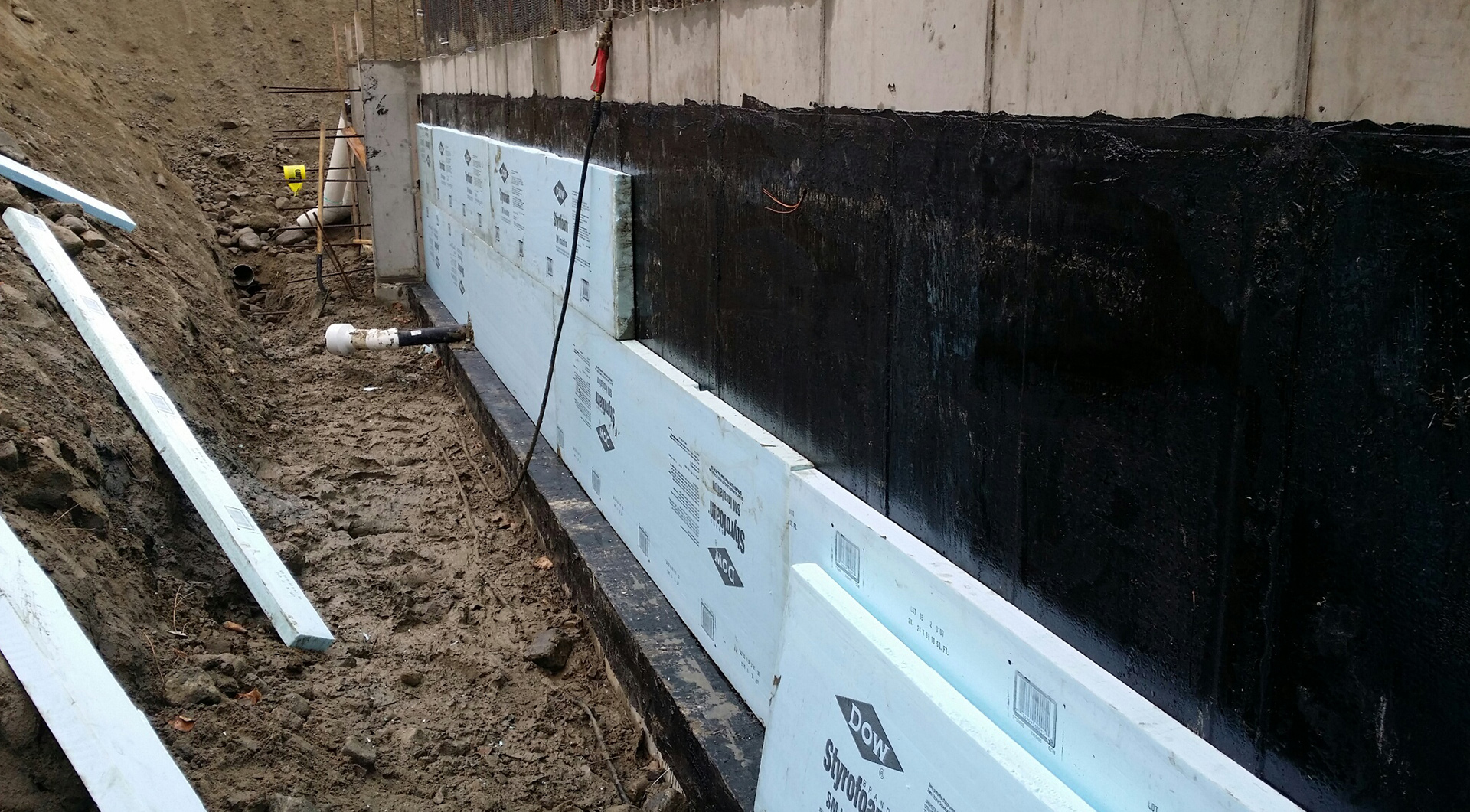 Foundation being waterproofed by TRS TOMTAR