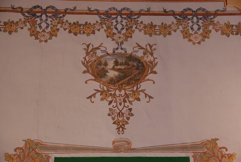 One of the ornamental paintings on the wall