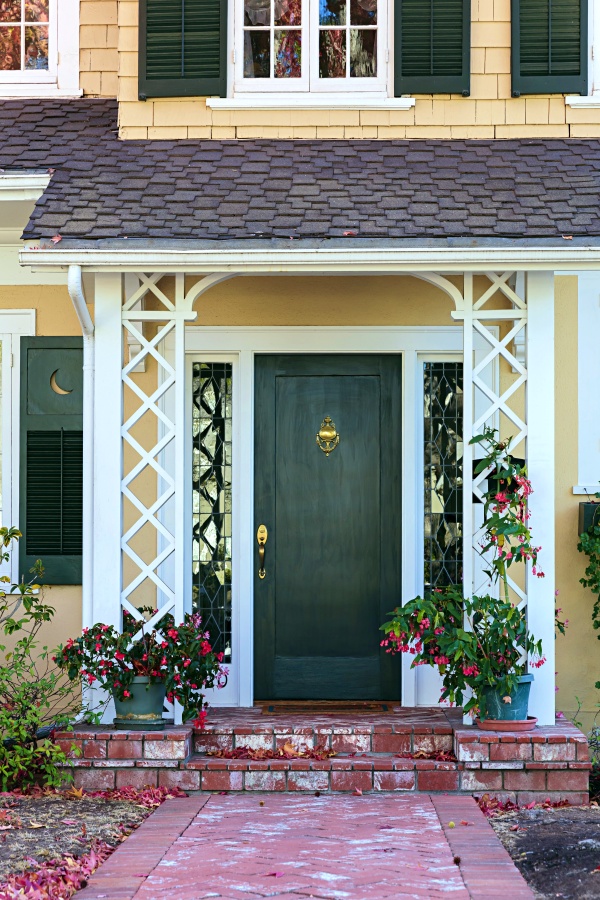 Green Front Door on Yellow Colonial Style Home