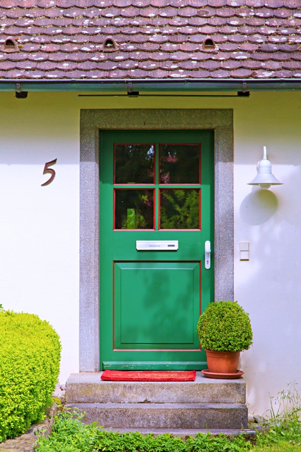 Green Windowed Exterior Door on a Quaint Cottage